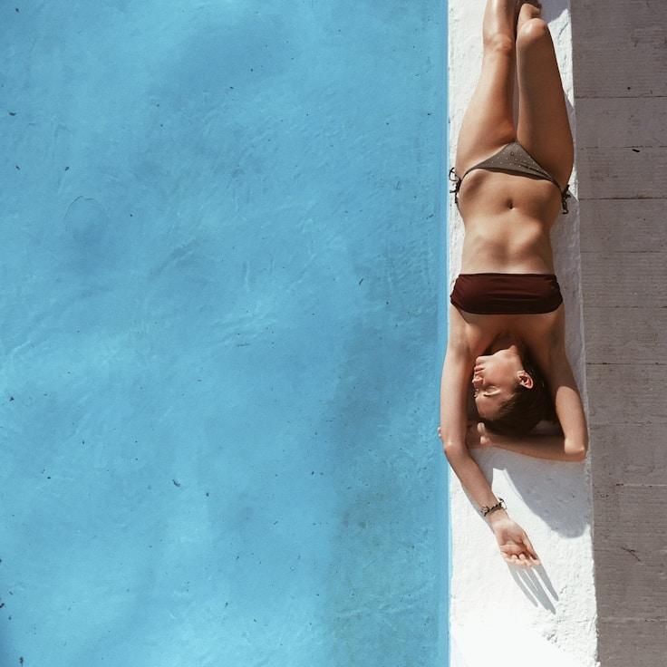 Women in a fitness class doing stretching and mobility exercises